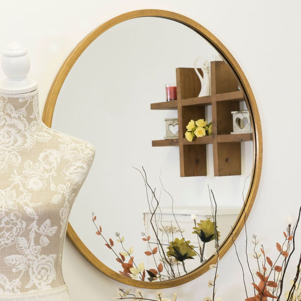 Gold round mirror